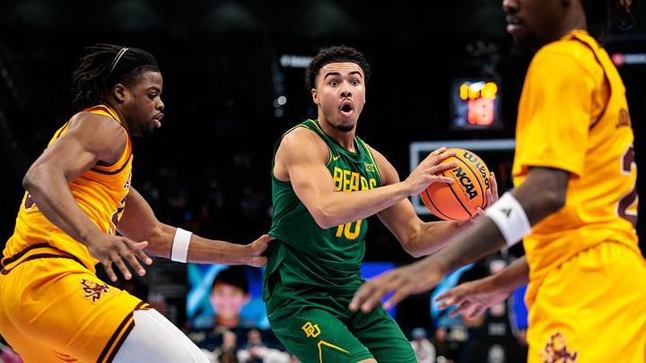 Mar 10, 2026; Kansas City, MO, USA; Baylor Bears guard Isaac Williams IV (10) drives around Arizona State Sun Devils forward Allen Mukeba (23) during the second half at T-Mobile Center. Mandatory Credit: William Purnell-Imagn Images