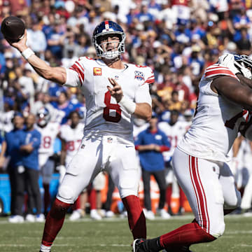 Sep 15, 2024; Landover, Maryland, USA; New York Giants quarterback Daniel Jones (8) passes the ball in the second half against the Washington Commanders at Commanders Field.  