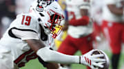 Oct 25, 2025; Pittsburgh, Pennsylvania, USA;  North Carolina State Wolfpack safety Tristan Teasdell (19) intercepts the ball against the Pittsburgh Panthers during the fourth quarter at Acrisure Stadium. Mandatory Credit: Charles LeClaire-Imagn Images