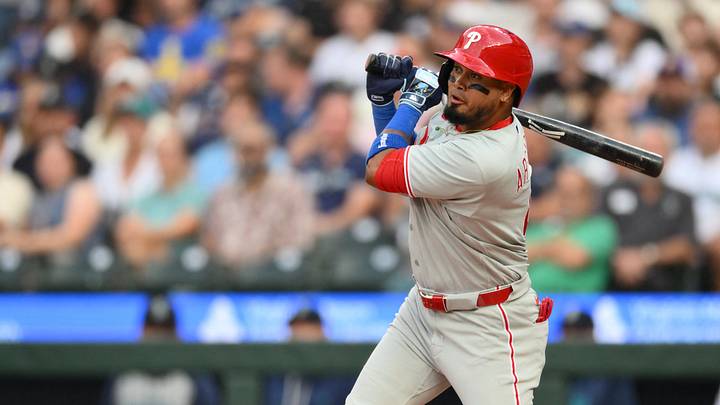 Aug 25, 2026; Seattle, Washington, USA; Philadelphia Phillies second baseman Luis Arraez (4) hits a single against the Seattle Mariners during the third inning at T-Mobile Park. Mandatory Credit: Steven Bisig-Imagn Images