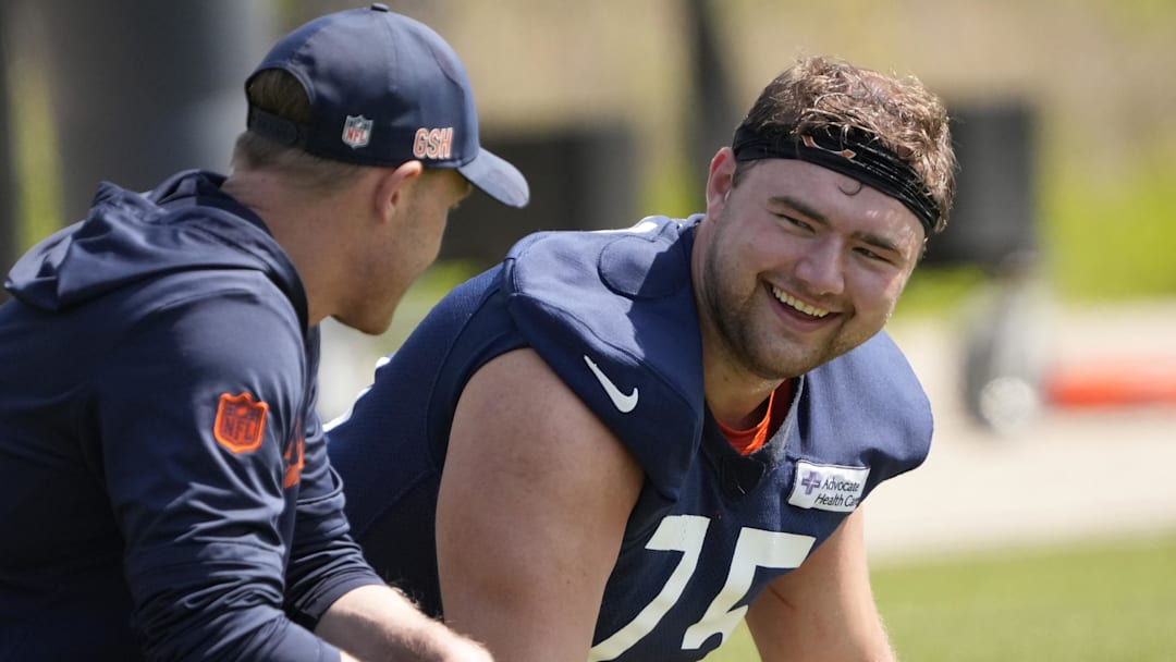 Chicago Bears head coach Ben Johnson talks with offensive lineman (75)  Ozzy Trapilo during rookie minicamp at Halas Hall.