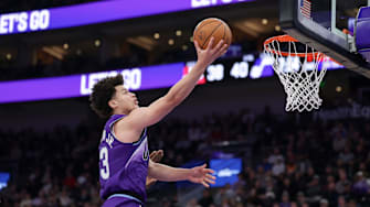 Dec 1, 2025; Salt Lake City, Utah, USA;  Utah Jazz guard Walter Clayton Jr. (13) lays the ball up to the basket during the second quarter against the Houston Rockets at Delta Center. Mandatory Credit: Chris Nicoll-Imagn Images