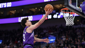 Dec 1, 2025; Salt Lake City, Utah, USA;  Utah Jazz guard Walter Clayton Jr. (13) lays the ball up to the basket during the second quarter against the Houston Rockets at Delta Center. Mandatory Credit: Chris Nicoll-Imagn Images