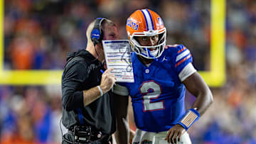 Oct 19, 2024; Gainesville, Florida, USA; Florida Gators head coach Billy Napier calls a play to Florida Gators quarterback DJ Lagway (2) against the Kentucky Wildcats during the second half at Ben Hill Griffin Stadium. Mandatory Credit: Matt Pendleton-Imagn Images
