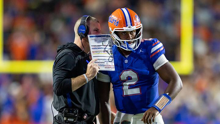 Oct 19, 2024; Gainesville, Florida, USA; Florida Gators head coach Billy Napier calls a play to Florida Gators quarterback DJ Lagway (2) against the Kentucky Wildcats during the second half at Ben Hill Griffin Stadium. Mandatory Credit: Matt Pendleton-Imagn Images