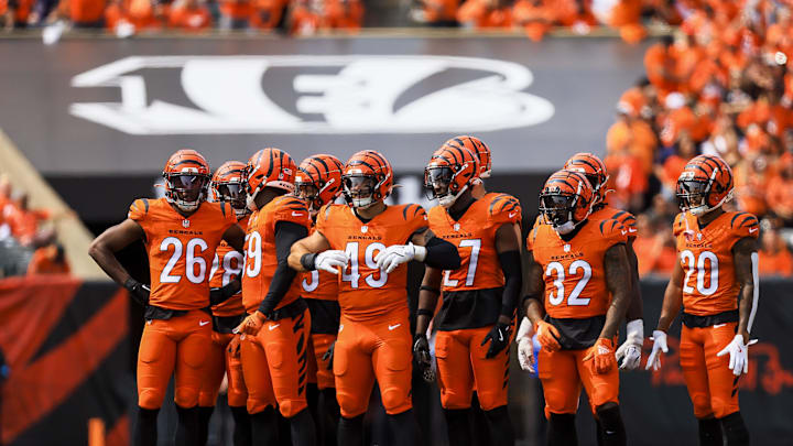 Sep 8, 2024; Cincinnati, Ohio, USA; Members of the Cincinnati Bengals stand on the field during a stop in play in the second half against the New England Patriots at Paycor Stadium. Mandatory Credit: Katie Stratman-Imagn Images