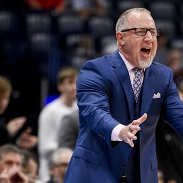 Mar 13, 2025; Nashville, TN, USA;  Texas A&M Aggies head coach Buzz Williams yells instructions to his team against the Texas Longhorns during the second half at Bridgestone Arena. Mandatory Credit: Steve Roberts-Imagn Images