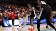 Nov 27, 2025; San Diego, CA, USA; Wisconsin Badgers guard Nick Boyd (2) handles the ball against Providence Friars forward Jamier Jones (5) during the second half at Jenny Craig Pavilion. 