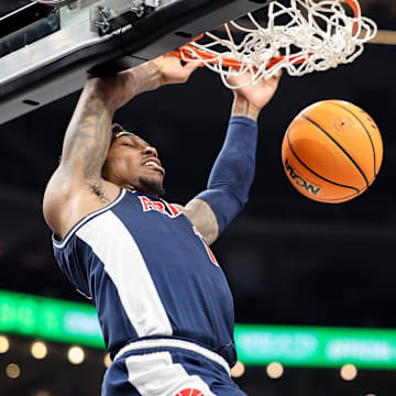Arizona Wildcats guard Caleb Love (1) dunks during the second half against the Texas Tech Red Raiders at T-Mobile Center.