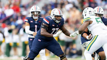 Nov 22, 2025; Tucson, Arizona, USA; Arizona Wildcats offensive lineman Michael Wooten (77) against the Baylor Bears at Casino Del Sol Stadium. Mandatory Credit: Mark J. Rebilas-Imagn Images