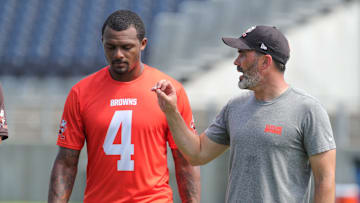 Quarterback Deshaun Watson, talking with coach Kevin Stefanski at a 2022 minicamp session, has only played in 19 of the Browns' 52 games since being acquired from the Texans in 2022.