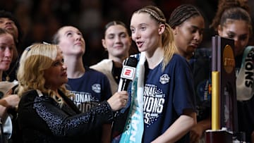 Apr 6, 2025; Tampa, FL, USA; Connecticut Huskies guard Paige Bueckers (5) is interviewed by ESPN reporter Holly Rowe after the national championship of the women's 2025 NCAA tournament against the South Carolina Gamecocks at Amalie Arena. Mandatory Credit: Nathan Ray Seebeck-Imagn Images