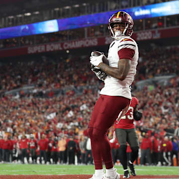 Jan 12, 2025; Tampa, Florida, USA; Washington Commanders wide receiver Dyami Brown (2) catches a touchdown during the second quarter of a NFC wild card playoff against the Tampa Bay Buccaneers at Raymond James Stadium. Mandatory Credit: Nathan Ray Seebeck-Imagn Images