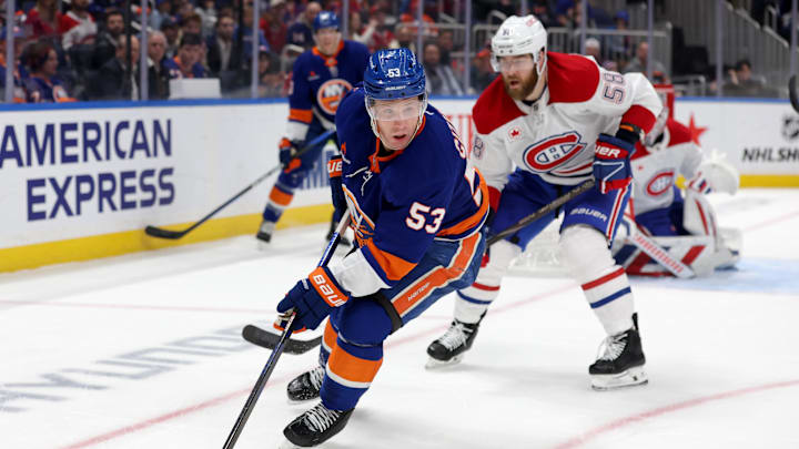 Mar 20, 2025; Elmont, New York, USA; New York Islanders center Casey Cizikas (53) skates with the puck against Montreal Canadiens defenseman David Savard (58) during the second period at UBS Arena. Mandatory Credit: Brad Penner-Imagn Images