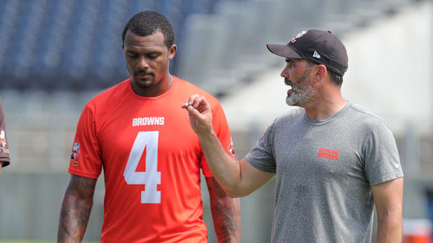 Quarterback Deshaun Watson, talking with coach Kevin Stefanski at a 2022 minicamp session, has only played in 19 of the Brown
