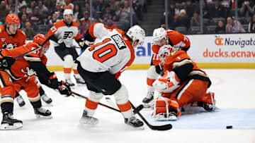 Dec 28, 2024; Anaheim, California, USA;  Philadelphia Flyers right wing Bobby Brink (10) fights for the puck against Anaheim Ducks goaltender Lukas Dostal (1) during the first period at Honda Center. Mandatory Credit: Kiyoshi Mio-Imagn Images