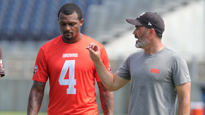 Quarterback Deshaun Watson, talking with coach Kevin Stefanski at a 2022 minicamp session, has only played in 19 of the Browns' 52 games since being acquired from the Texans in 2022.