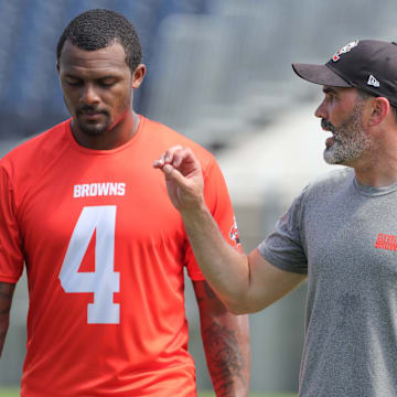 Quarterback Deshaun Watson, talking with coach Kevin Stefanski at a 2022 minicamp session, has only played in 19 of the Browns' 52 games since being acquired from the Texans in 2022.