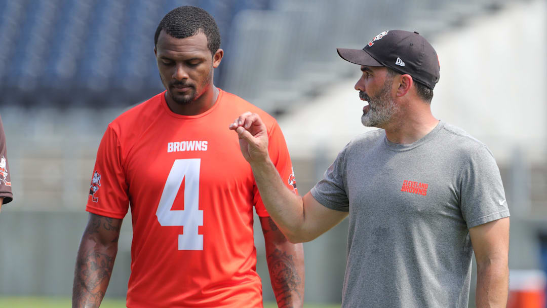 Browns quarterback Deshaun Watson talks with coach Kevin Stefanski after minicamp on Wednesday, June 15, 2022, in Canton.