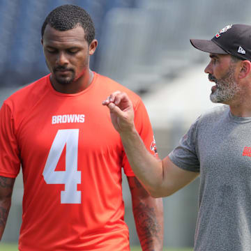 Browns quarterback Deshaun Watson talks with coach Kevin Stefanski after minicamp on Wednesday, June 15, 2022, in Canton.