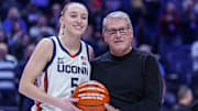 Jan 22, 2025; Storrs, Connecticut, USA; UConn Huskies guard Paige Bueckers (5) is recognized with head coach Geno Auriemma for her 2000 career points before the start of the game against the Villanova Wildcats at Harry A. Gampel Pavilion. Mandatory Credit: David Butler II-Imagn Images