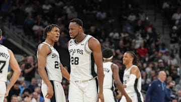Nov 9, 2022; San Antonio, Texas, USA;  San Antonio Spurs guard Devin Vassell (24) celebrates a play by San Antonio Spurs center Charles Bassey (28) in the first half against the Memphis Grizzlies at the AT&T Center. Mandatory Credit: Daniel Dunn-Imagn Images