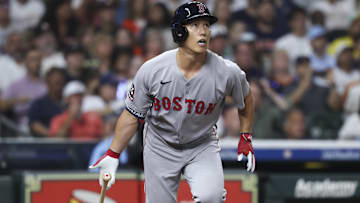 Boston Red Sox pinch hitter Masataka Yoshida (7) hits an RBI double during the seventh inning against the Houston Astros at Daikin Park.