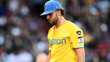 Boston Red Sox starting pitcher Kutter Crawford (50) walks off the field after being taken out of the game in the fifth inning against the Tampa Bay Rays at Fenway Park.