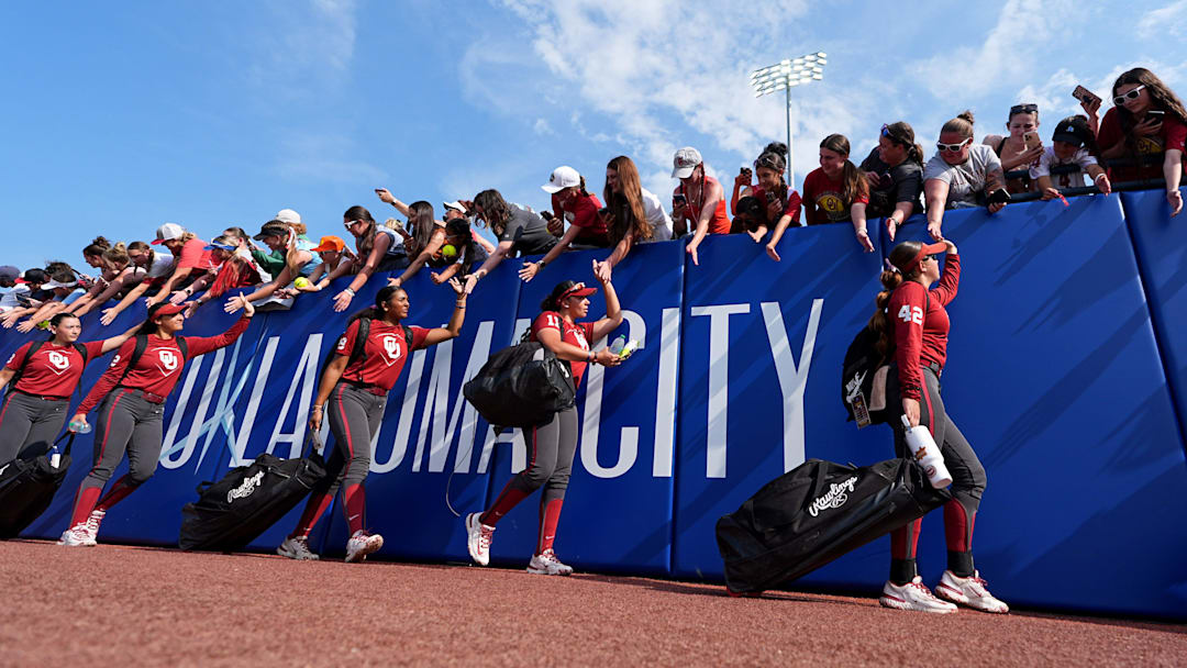 Oklahoma arrives for the Women's College World Series softball game between the Texas Tech Raiders and the Oklahoma Sooners at Devon Park in Oklahoma City, Monday, June 2, 2025.