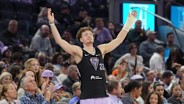 Jun 1, 2025; San Francisco, California, USA; Golden State Warriors guard Brandin Podziemski (center) cheers during the third quarter of the game between the Golden State Valkyries and the Minnesota Lynx at Chase Center. Mandatory Credit: Darren Yamashita-Imagn Images