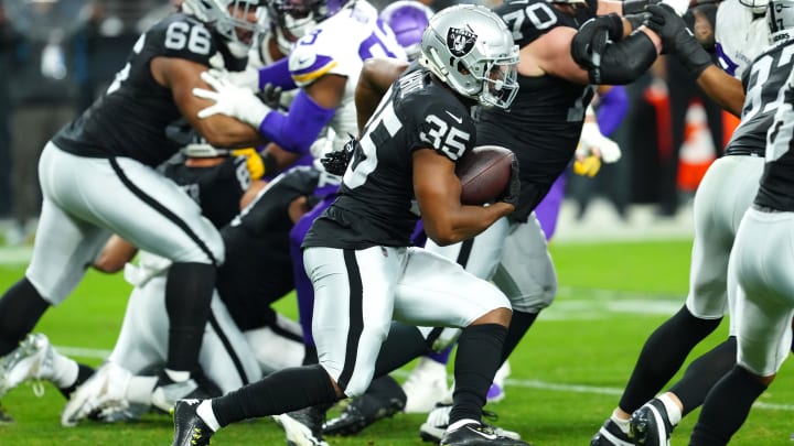 Dec 10, 2023; Paradise, Nevada, USA; Las Vegas Raiders running back Zamir White (35) rushes against the Minnesota Vikings during the fourth quarter at Allegiant Stadium. Mandatory Credit: Stephen R. Sylvanie-USA TODAY Sports