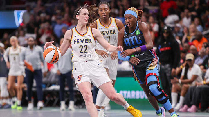 Indiana Fever guard Caitlin Clark is fouled by Atlanta Dream guard Rhyne Howard in the fourth quarter at State Farm Arena Indiana Fever guard Caitlin Clark is fouled by Atlanta Dream guard Rhyne Howard in the fourth quarter at State Farm Arena