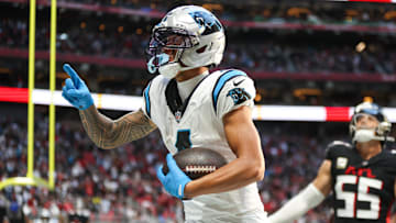 Nov 16, 2025; Atlanta, Georgia, USA; Carolina Panthers wide receiver Tetairoa McMillan (4) celebrates a touchdown in the fourth quarter against the Atlanta Falcons at Mercedes-Benz Stadium. Mandatory Credit: Brett Davis-Imagn Images