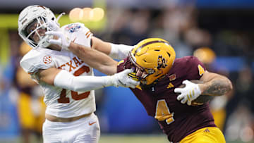 Texas Longhorns defensive back Michael Taaffe (L) and Arizona State Sun Devils running back Cam Skattebo (R)