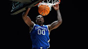 Mar 28, 2025; Indianapolis, IN, USA; Kentucky Wildcats guard Otega Oweh (00) dunks the ball against the Tennessee Volunteers in the second half during a Midwest Regional semifinal of the 2025 NCAA tournament at Lucas Oil Stadium. Mandatory Credit: Robert Goddin-Imagn Images