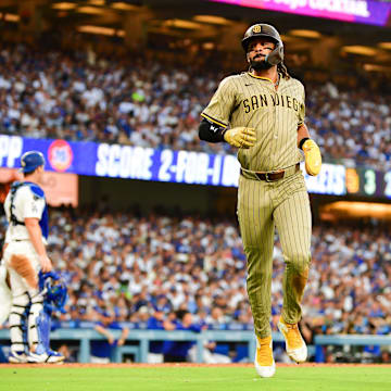 San Diego Padres right fielder Fernando Tatis Jr. (23) scores a run during the third inning against the Los Angeles Dodgers at Dodger Stadium on June 17.