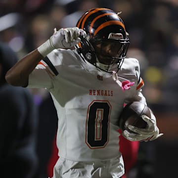 Fleet Central East wide receiver Xavior Jones salutes after scoring on a 52-yard reverse in the second quarter of his team's 55-36 CIF Northern California Division 1-A championship win at Pittsburg on Dec. 6.