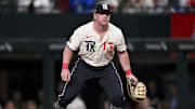 May 2, 2025; Arlington, Texas, USA; Texas Rangers first baseman Blaine Crim (13) starts at first base during the first inning Seattle Mariners at Globe Life Field
