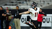 Desert Edge receiver Malakai Moala (11) celebrates a touchdown against Cactus during the 5A State Championship game at Mountain America Stadium on Dec. 6, 2024.