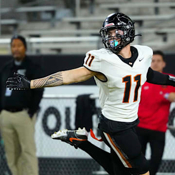 Desert Edge receiver Malakai Moala (11) celebrates a touchdown against Cactus during the 5A State Championship game at Mountain America Stadium on Dec. 6, 2024.
