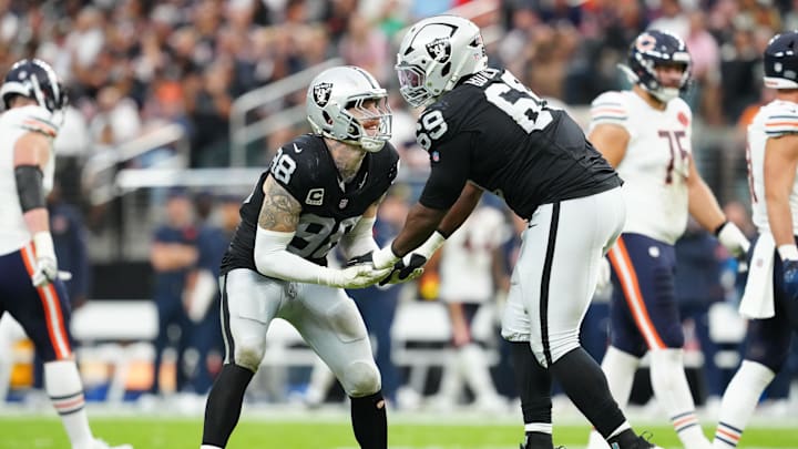 Sep 28, 2025; Paradise, Nevada, USA; Las Vegas Raiders defensive end Maxx Crosby (98) celebrates a play with defensive tackle Adam Butler (69) during the second half against the Chicago Bears at Allegiant Stadium. Mandatory Credit: Stephen R. Sylvanie-Imagn Images Sep 28, 2025; Paradise, Nevada, USA; Las Vegas Raiders defensive end Maxx Crosby (98) celebrates a play with defensive tackle Adam Butler (69) during the second half against the Chicago Bears at Allegiant Stadium. Mandatory Credit: Stephen R. Sylvanie-Imagn Images