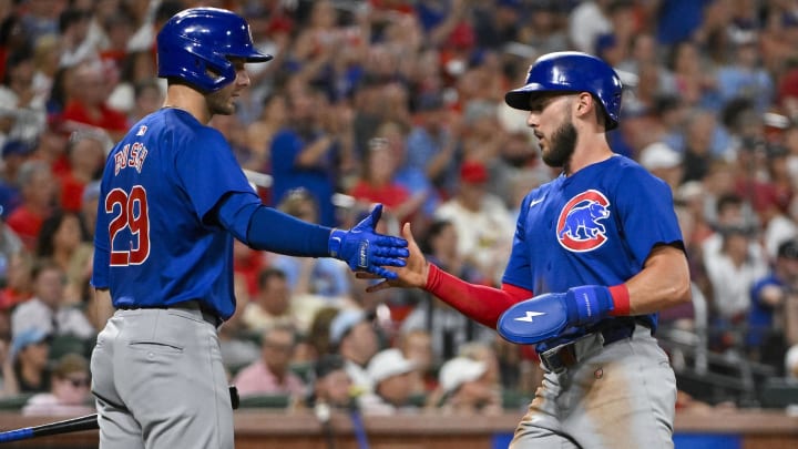 Jul 12, 2024; St. Louis, Missouri, USA;  Chicago Cubs third baseman Miles Mastrobuoni (20) is congratulated by first baseman Michael Busch (29) after scoring against the St. Louis Cardinals during the seventh inning at Busch Stadium.