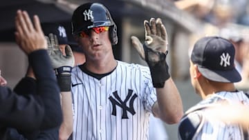 Aug 25, 2024; Bronx, New York, USA;  New York Yankees first baseman DJ LeMahieu (26) is greeted in the dugout after scoring in the second inning against the Colorado Rockies at Yankee Stadium. Mandatory Credit: Wendell Cruz-Imagn Images