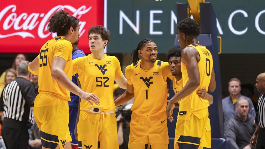 Jan 10, 2026; Morgantown, West Virginia, USA; West Virginia Mountaineers players huddle during the second half against the Kansas Jayhawks at Hope Coliseum. Mandatory Credit: Ben Queen-Imagn Images