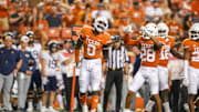 Texas Longhorns linebacker DeMarvion Overshown celebrates following a defensive stop during the fourth quarter