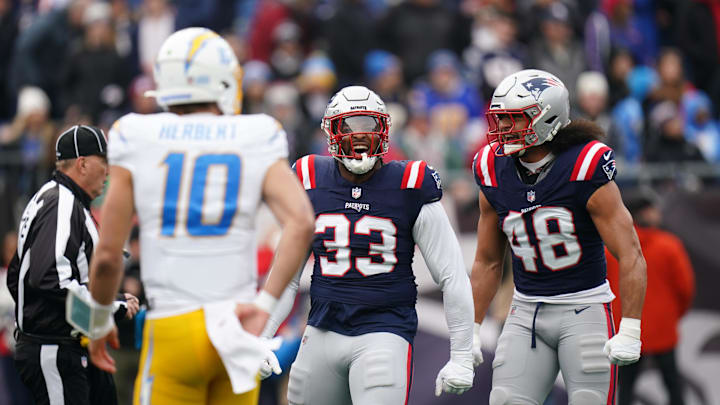 Dec 28, 2024; Foxborough, Massachusetts, USA; New England Patriots linebacker Anfernee Jennings (33) reacts after a play against the Los Angeles Chargers in the first quarter at Gillette Stadium. Mandatory Credit: David Butler II-Imagn Images