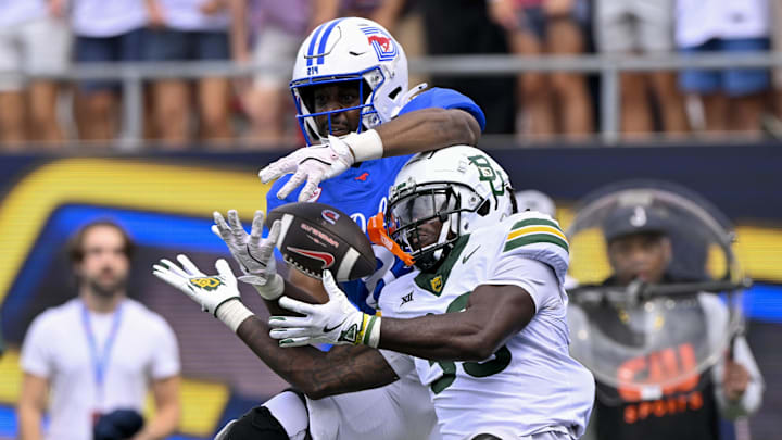 Sep 6, 2025; Dallas, Texas, USA; Baylor Bears safety DJ Coleman (33) breaks up a pass intended for SMU Mustangs tight end RJ Maryland (82) during the second overtime at Gerald J. Ford Stadium. Mandatory Credit: Jerome Miron-Imagn Images