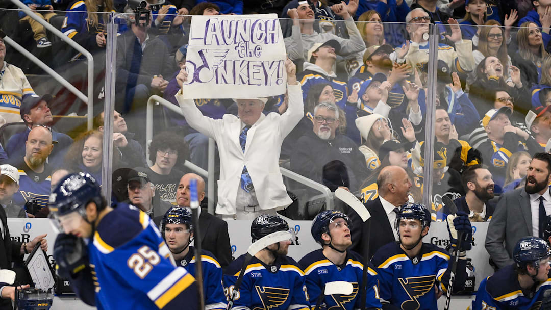 Apr 3, 2025; St. Louis, Missouri, USA;  St. Louis Blues fans holds up a sign during the second period against the Pittsburgh Penguins at Enterprise Center. Mandatory Credit: Jeff Curry-Imagn Images