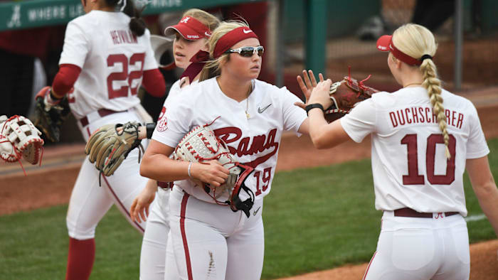 Mar 9, 2024; Tuscaloosa, Alabama, USA; Alabama pitcher Kayla Beaver greets first baseman Abby