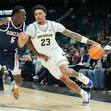 Michigan forward Yaxel Lendeborg drives while defended by Gonzaga forward Emmanuel Innocenti in the Players Era championship game.